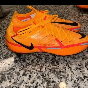 New Nike Kids' Phantom Soccer Cleats in Bright Orange with Black Swoosh